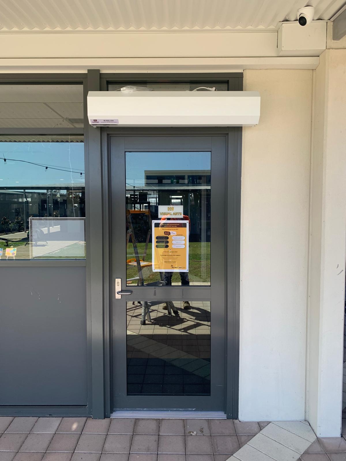 Air Glass door with an installed air curtain