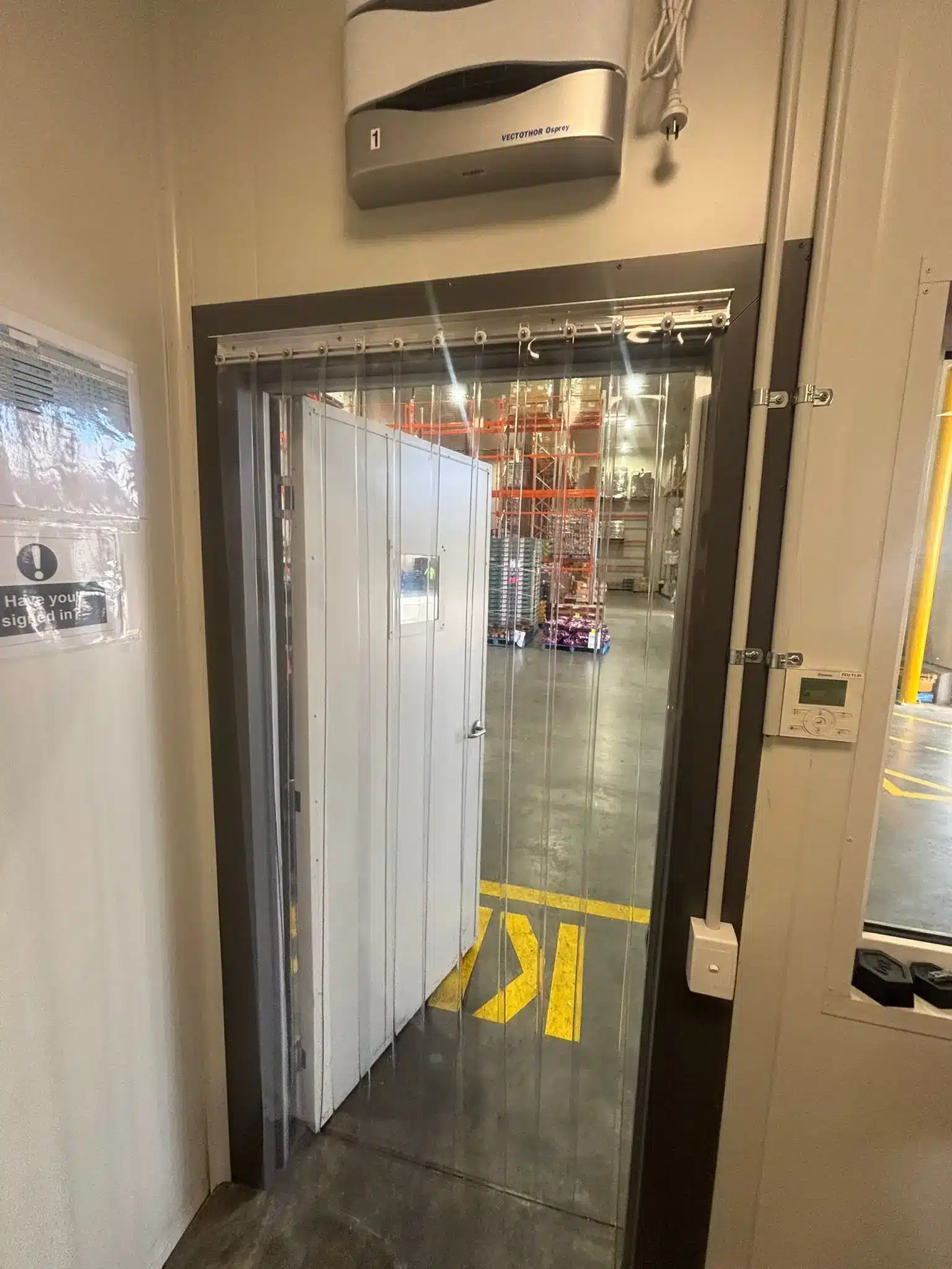 Strip curtain partially open insulated door