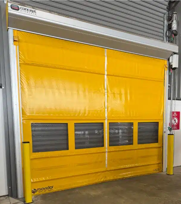 Yellow Movidor HS35 industrial high-speed door with vision panels and Concept Products branding.